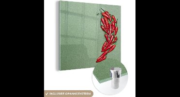 MuchoWow® Glasschilderij 20x20 cm - Schilderij acrylglas - Chilipepers vormen een chilipeper - Foto op glas - Schilderijen