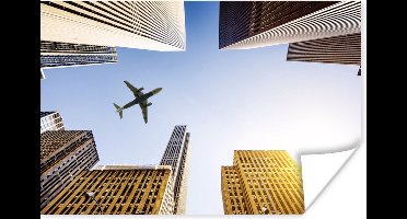 Poster Vliegtuig tussen de wolkenkrabbers - 30x20 cm