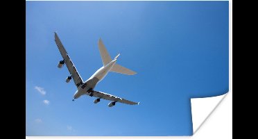 Poster Vliegtuig die in de helder blauwe lucht vliegt - 30x20 cm