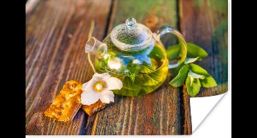 Poster Glazen theepot op een houten tafel - 30x20 cm