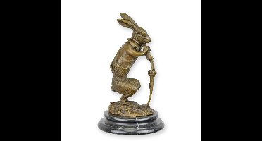 A BRONZE SCULPTURE OF A HUNTING HARE