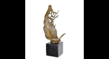 A BRONZE SCULPTURE OF A PIGEOONS FLYING OUT A LEAF