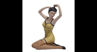 A RESIN FIGURINE OF A PIN-UP GIRL
