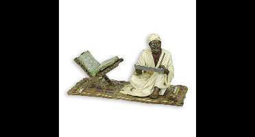 A BRONZE SCULPTURE OF A FEMALE NUDE ON CARPET