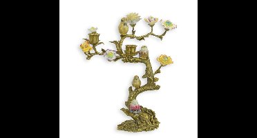 A BRONZE CANDLE STAND MOUNTED WITH PORCELAIN BIRDS