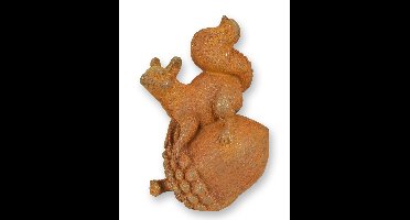 A RUSTY CAST IRON FIGURINE OF A SQUIRREL ON AN ACORN