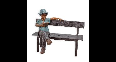 A BRONZE SCULPTURE OF A BOY SITTING ON A BENCH