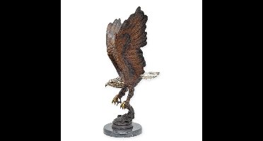A BRONZE SCULPTURE OF AN EAGLE FISHING FOR SALMON