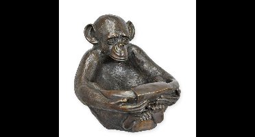 A BRONZE CHIMPANSEE HOLDING A BOWL