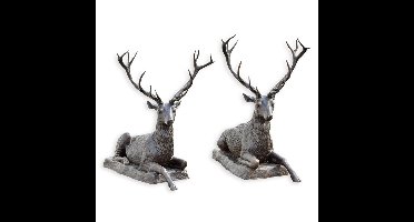 A BRONZE PAIR OF RECLINING DEER