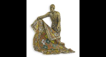A BRONZE SCULPTURE OF AN ARAB CARPET SELLER