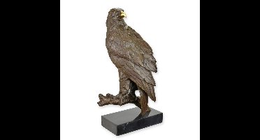 A BRONZE SCULPTURE OF AN EAGLE AT REST